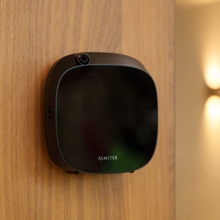 Aroma diffuser black hanging on wooden backdrop